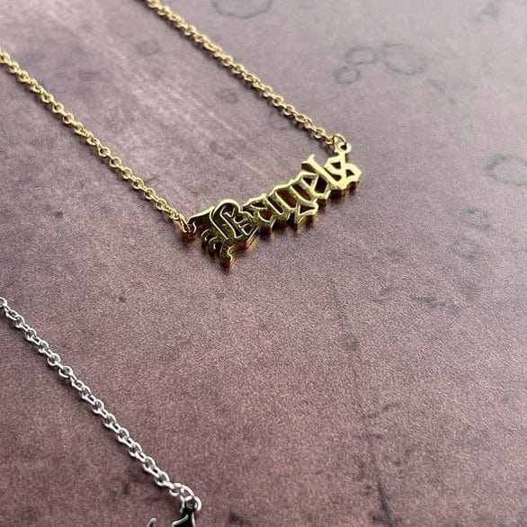 The Silver Spider Necklaces Gold Bagels Word Necklace - Gold