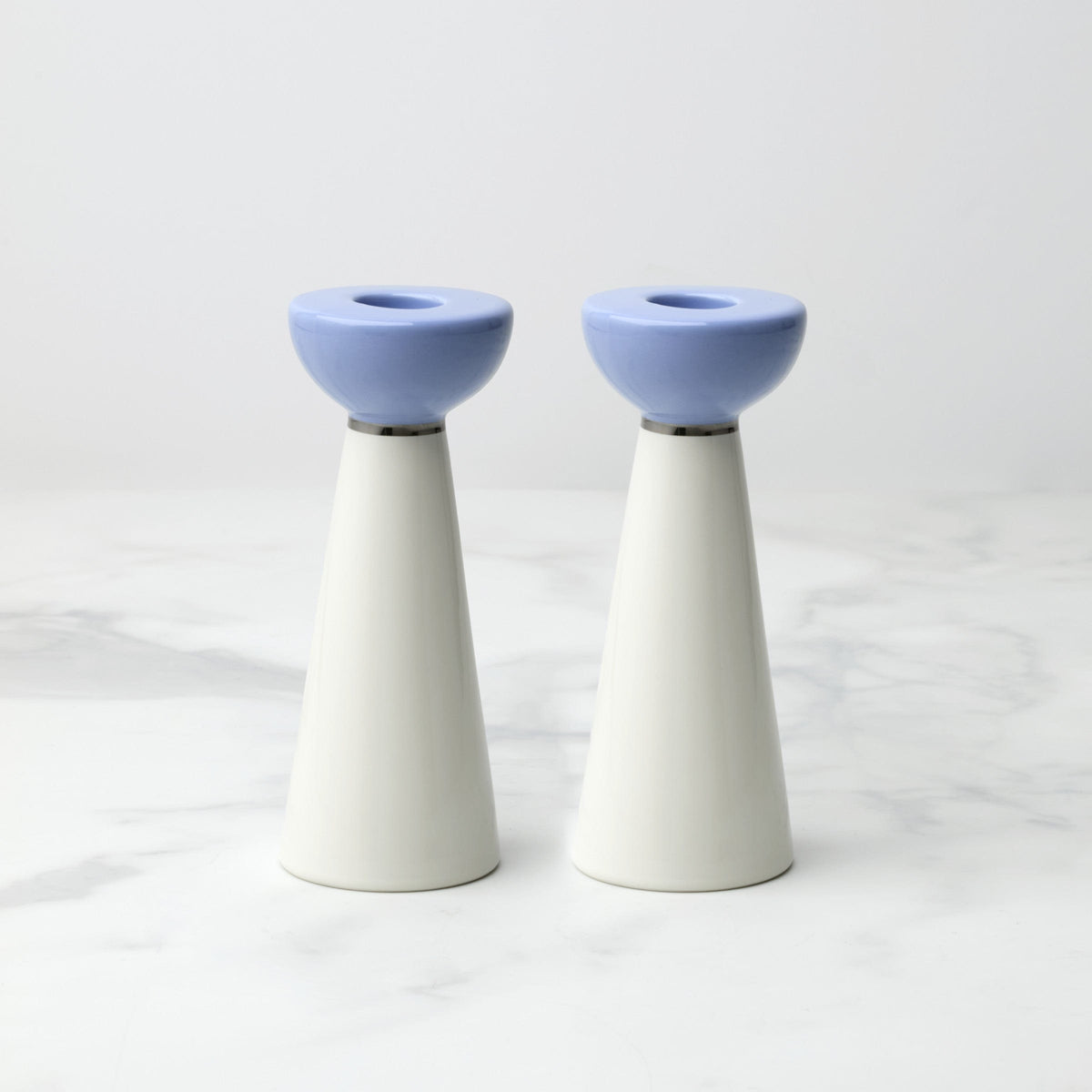 Shabbat candlesticks on a dinner table