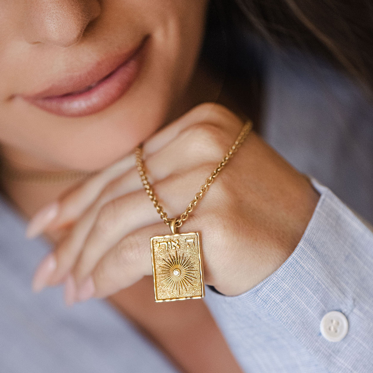 Hashem Is My Light pendant held in hand