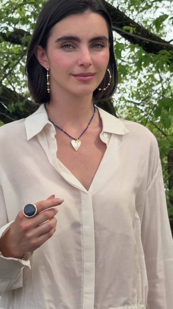 Sylvie lapis and mother of pearl chai necklace worn on model