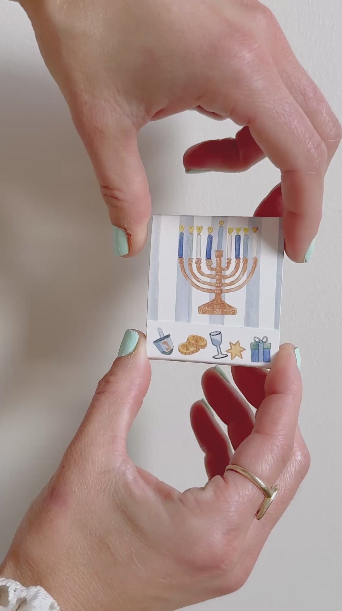 Happy Hanukkah matchbook opened to show the illustrated matches