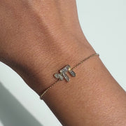 Hebrew Chai Baguette Diamond Bracelet worn on a wrist, showcasing the intricate design and elegance.