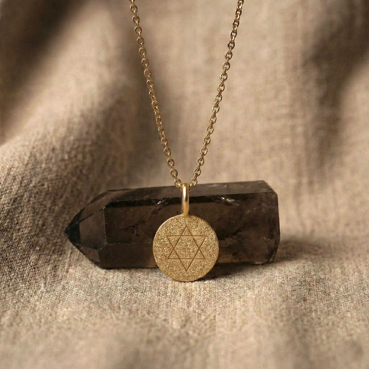 Classic Star of David coin necklace styled with crystal