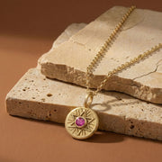 Radiant Star of David necklace styled on stone