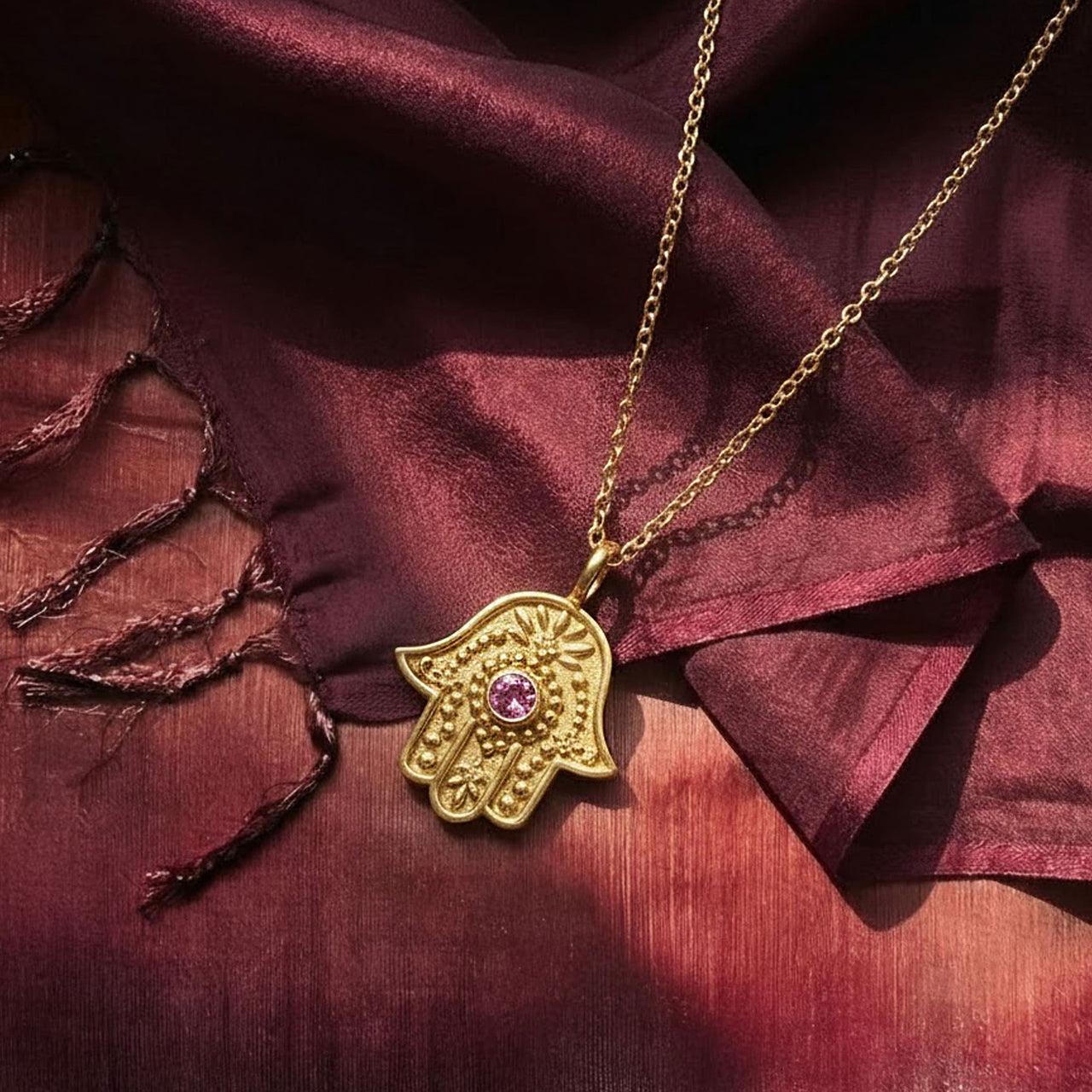 Eternal Pulse Hamsa necklace styled on silk