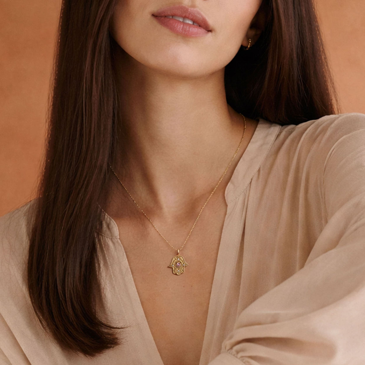 Eternal Pulse Hamsa necklace styled on linen