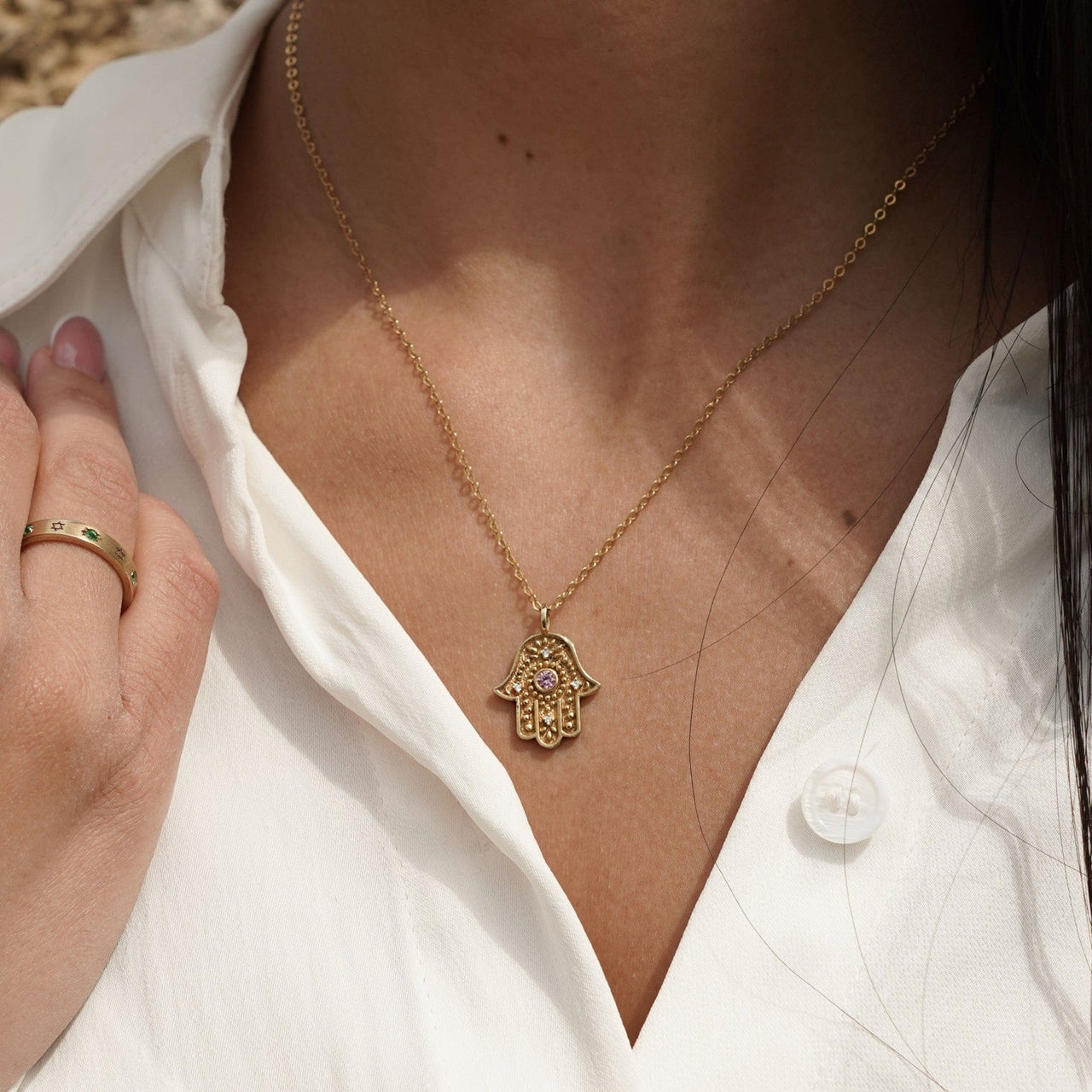 Eternal Pulse Hamsa necklace, worn