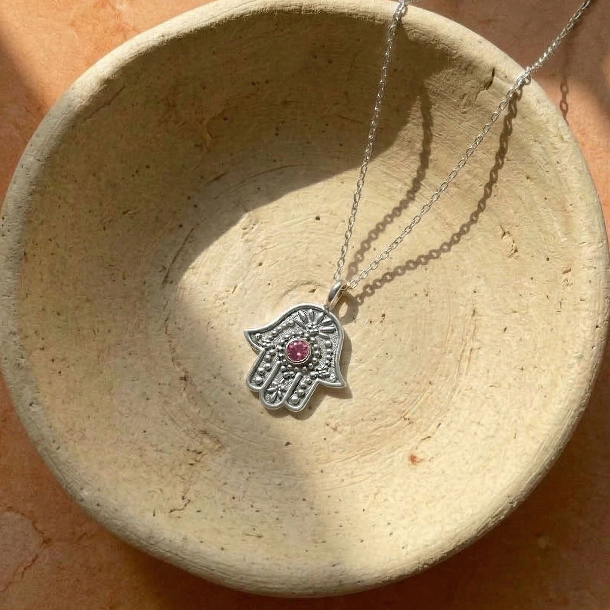 Eternal Pulse Hamsa necklace detail