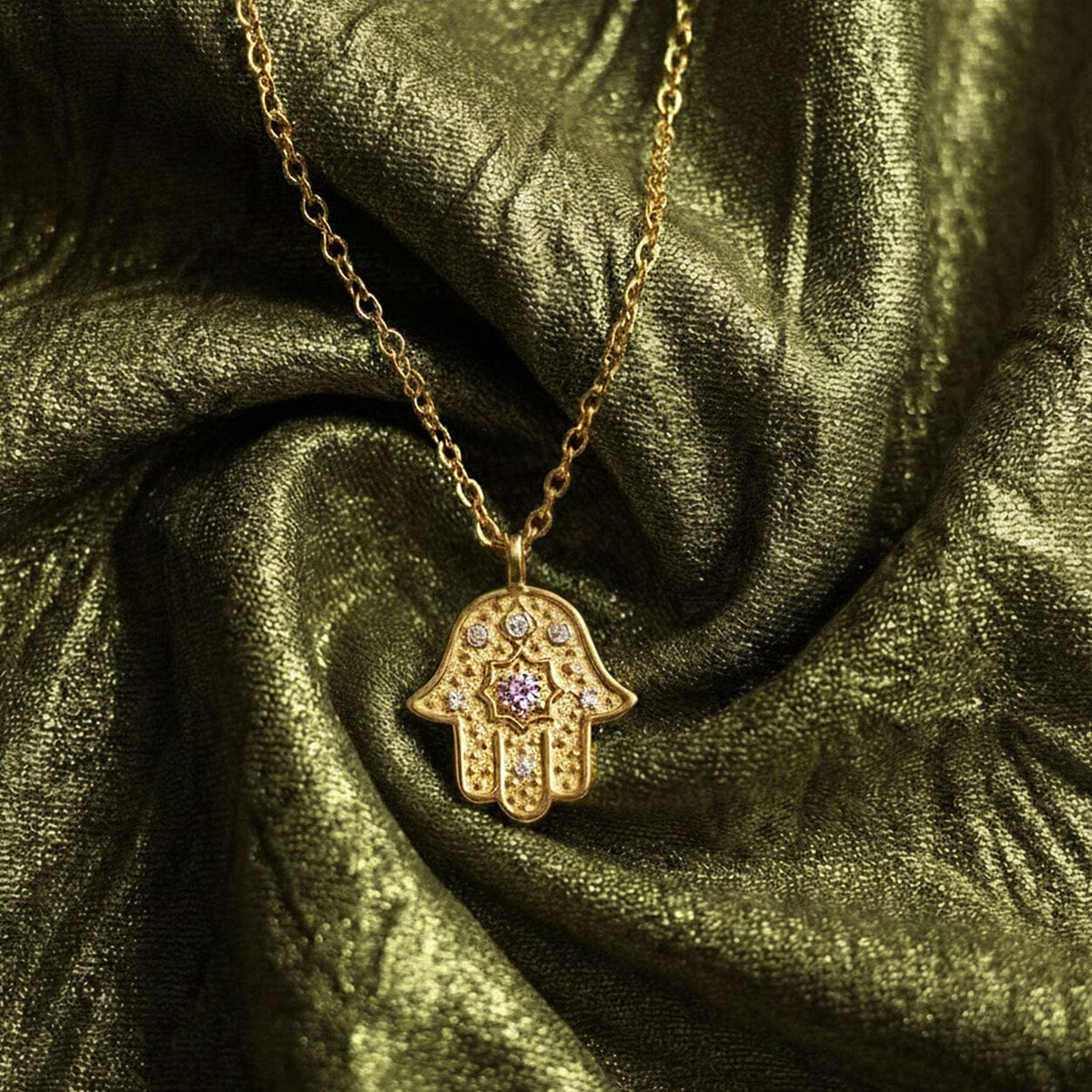 Radiant Anchor Hamsa necklace styled on silk